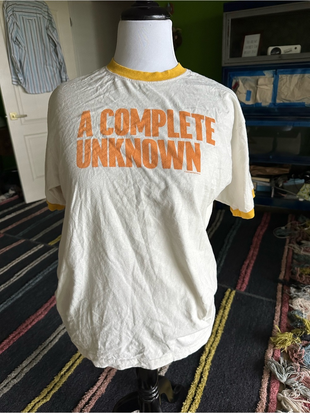 Cream Ringer Tee with Orange 'A COMPLETE UNKNOWN' Print